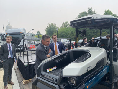 Sen.-Martin-Heinrich-looking-at-EV-tractor.jpg